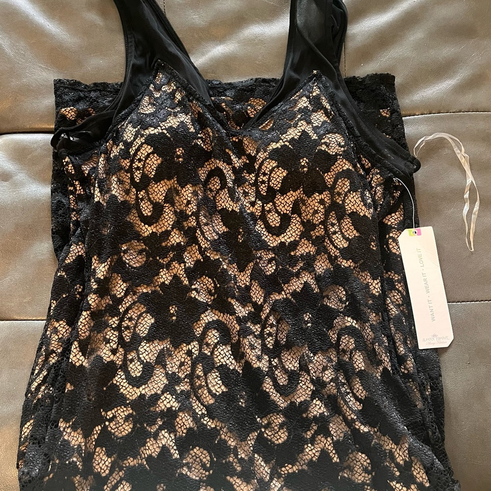 Brand new- black lacy dress with skin color mesh underneath.